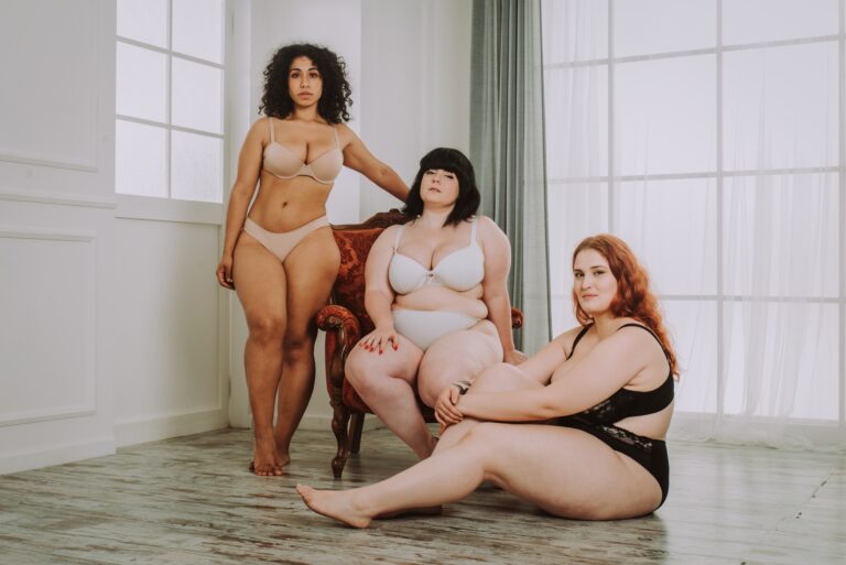 Plus size women posing for body acceptance